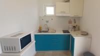 Kuchyňa alebo kuchynka v ubytovaní Apartman Lapis