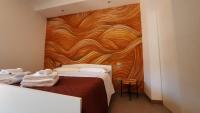 A bed or beds in a room at WiSaRelax