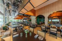 an image of a restaurant with tables and chairs at PARKROYAL COLLECTION Marina Bay, Singapore in Singapore