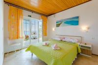 Posteľ alebo postele v izbe v ubytovaní Rooms Sani