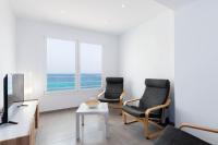 Televízia a/alebo spoločenská miestnosť v ubytovaní YourHouse Monges Apartment with sea views