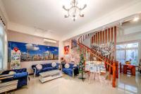 a living room with blue furniture and a staircase at Shanghai Time in Hualien City