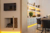 A television and/or entertainment centre at Palazzo Lecce - Epoca Collection