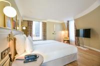 Cama o camas de una habitaci&oacute;n en XO Hotel Paris