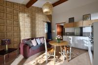 a living room with a couch and a table at Les Mazets de Marie de Jules in Eyragues