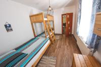 Posteľ alebo postele v izbe v ubytovaní Apartament Marcel