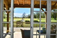 a view from a door looking out at a yard at Manoir de Malagorse in Cuzance