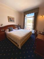 Posteľ alebo postele v izbe v ubytovaní Hotel Savoy