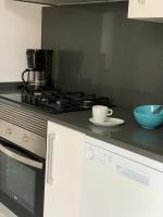 Kuchyň nebo kuchyňský kout v ubytování Apartaments El Cine