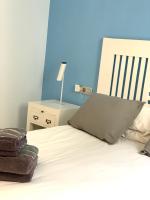 Postel nebo postele na pokoji v ubytování Apartaments El Cine