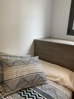 Postel nebo postele na pokoji v ubytování Apartaments El Cine