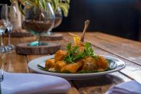 a plate of food on a wooden table at El Sendero del Quindío I Finca Hotel I Eje Cafetero in Calarcá