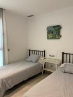 Postel nebo postele na pokoji v ubytování Apartaments El Cine