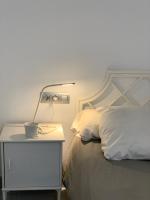Postel nebo postele na pokoji v ubytování Apartaments El Cine
