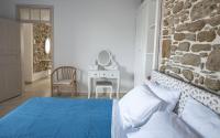 A bed or beds in a room at Anastasia Traditional House