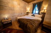 Postel nebo postele na pokoji v ubytování Duven Hotel Cappadocia
