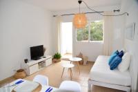 Televízia a/alebo spoločenská miestnosť v ubytovaní Apartamentos CostaMar 1; Apartamento nº11
