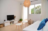 Televízia a/alebo spoločenská miestnosť v ubytovaní Apartamentos CostaMar 1; Apartamento nº11