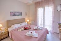 Posteľ alebo postele v izbe v ubytovaní Sun & Sea Luxury Apartment