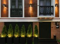 a facade of a building with trees and lights at Original Boutique Hotel in Tbilisi City