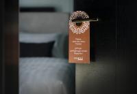a doorhandle to a bedroom with a door tag on it at Original Boutique Hotel in Tbilisi City