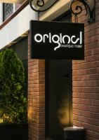 a sign hanging outside of a boutique hotel at Original Boutique Hotel in Tbilisi City