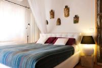 A bed or beds in a room at At Home In Maremma