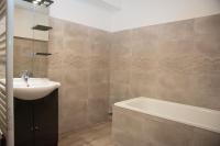 a bathroom with a sink and a bath tub at Damville Centre in Damville