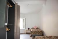 a small room with two beds and a window at Damville Centre in Damville