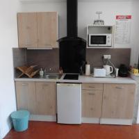 a kitchen with a white refrigerator and a microwave at Villa Zola in Aix-en-Provence