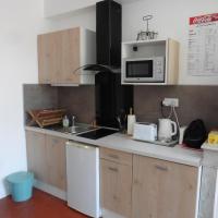 a kitchen with a sink and a microwave at Villa Zola in Aix-en-Provence
