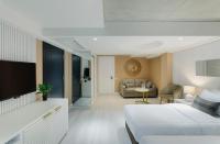 a bedroom with a bed and a living room at Original Boutique Hotel in Tbilisi City