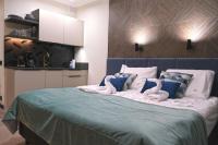 Posteľ alebo postele v izbe v ubytovaní Blue Horizon Apartments