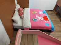 a bunk bed with a hello kitty blanket on it at Happy Castle Cottage in Hualien City