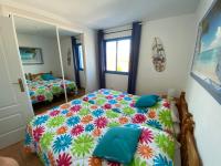 A bed or beds in a room at Perla Blanca 3