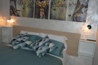 A bed or beds in a room at B&b Ilary Home