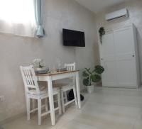 A television and/or entertainment centre at B&b Ilary Home