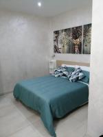 A bed or beds in a room at B&b Ilary Home