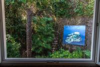 a view of a picture of a boat in the water at Hotel Villa Ruscello in Baveno
