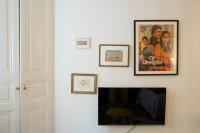 a living room with a fireplace and a picture on the wall at Le Studio Gab&#39;s - Coup de coeur déco tout confort in Caluire-et-Cuire