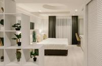 a bedroom with a bed in a room with plants at Original Boutique Hotel in Tbilisi City