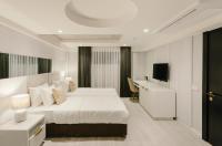 a hotel room with a bed and a desk at Original Boutique Hotel in Tbilisi City