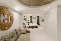 a living room with a couch and a table at Original Boutique Hotel in Tbilisi City
