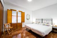 Postel nebo postele na pokoji v ubytování Holi-Rent Estrella