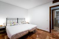 Postel nebo postele na pokoji v ubytování Holi-Rent Estrella