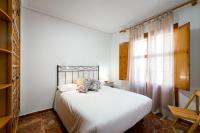 Postel nebo postele na pokoji v ubytování Holi-Rent Estrella