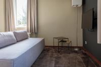 TV a/nebo společenská místnost v ubytování Fletcher Kloosterhotel Willibrordhaeghe