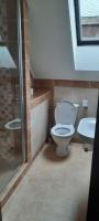 Kúpeľňa v ubytovaní Kemencés Kert Apartment