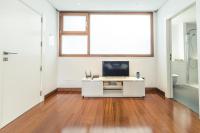 A television and/or entertainment centre at Melenara Beach Avenue Apt Shared Terrace