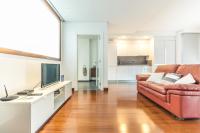 A television and/or entertainment centre at Melenara Beach Avenue Apt Shared Terrace